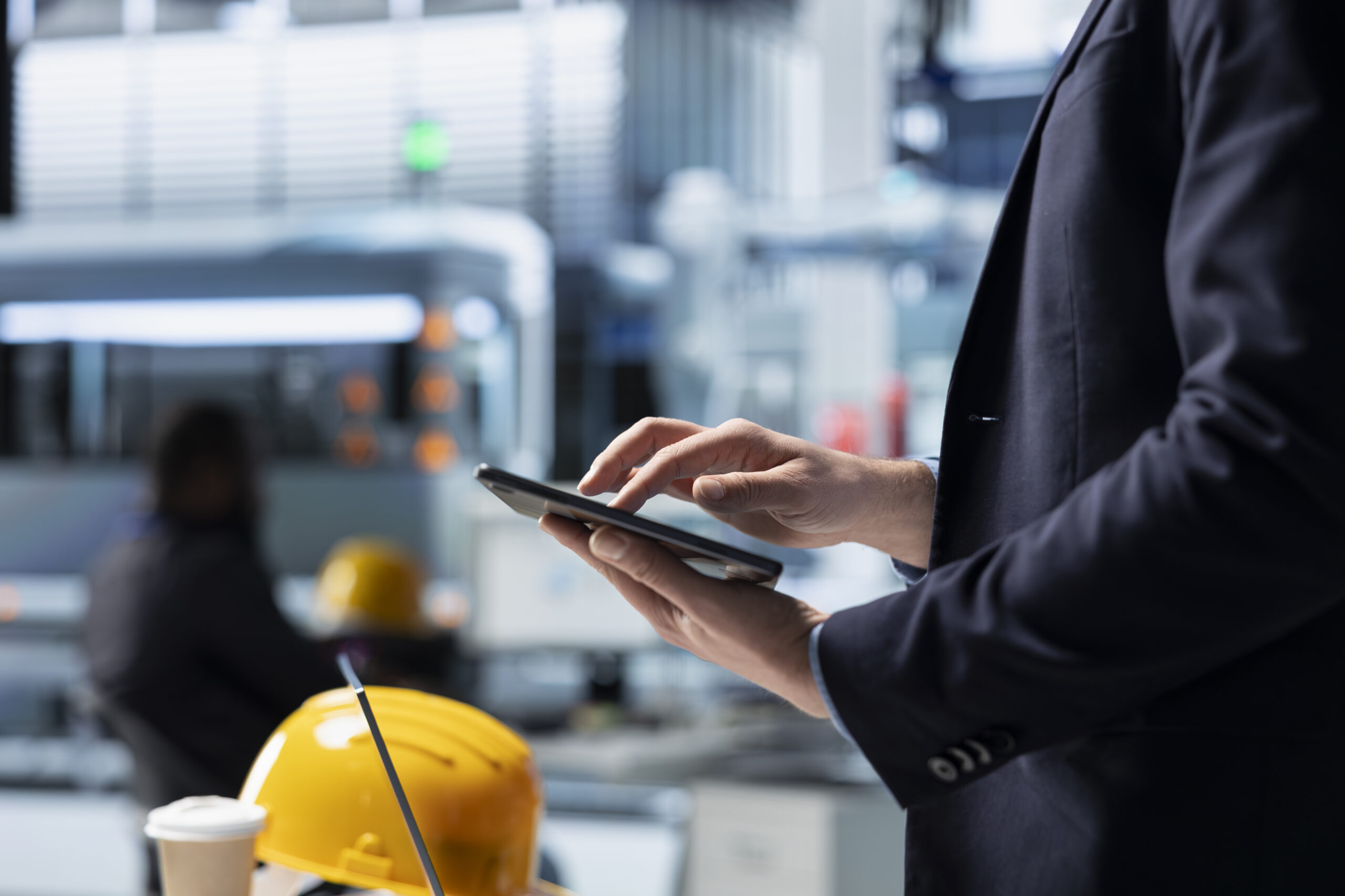 Operations director in a solar panel factory monitoring efficiency metrics